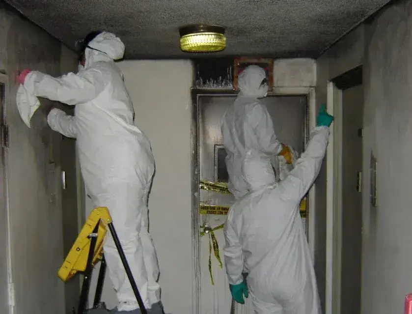 Homeowner documenting water damage in preparation for an assessment